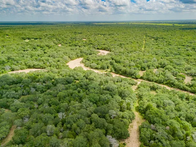 a view of a lake with a big yard