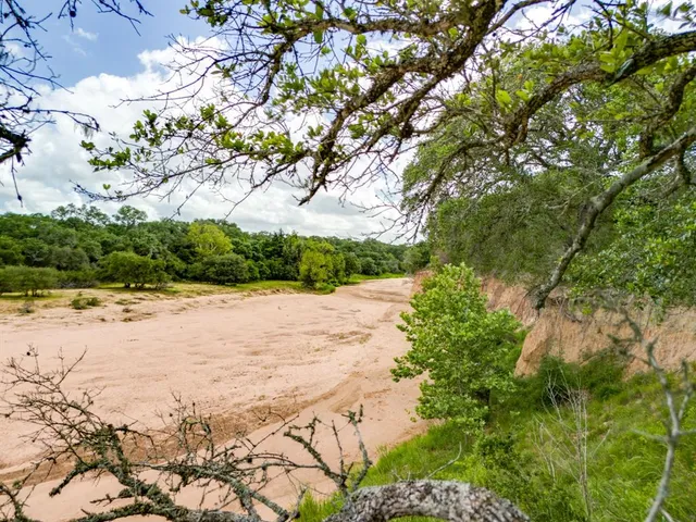 a view of a lake with a yard