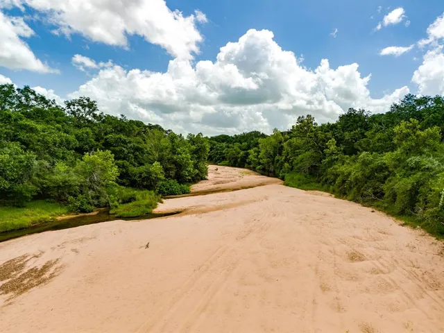 a view of a yard with an outdoor space