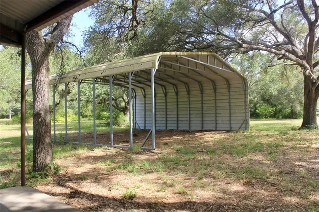 a view of a yard with a tree