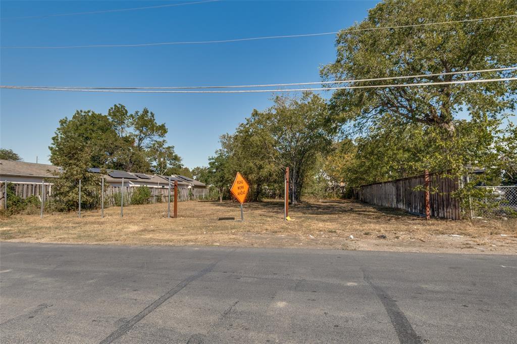 5115 Spruce Street Dallas, TX 75211 - Photo 2 of 10 a backyard of a house with plants and trees
