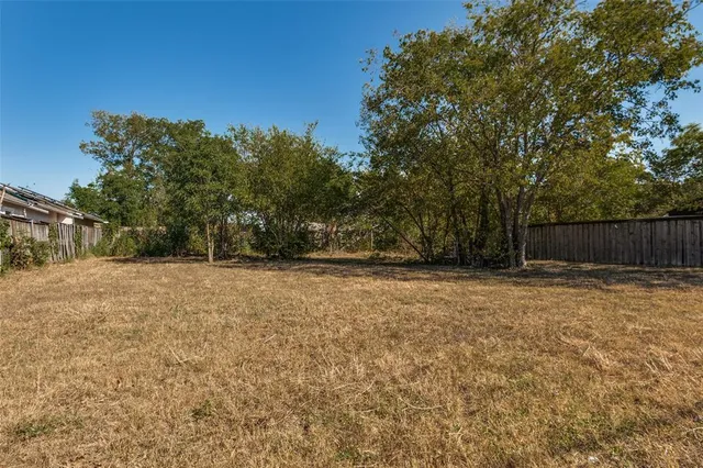 a view of backyard with green space
