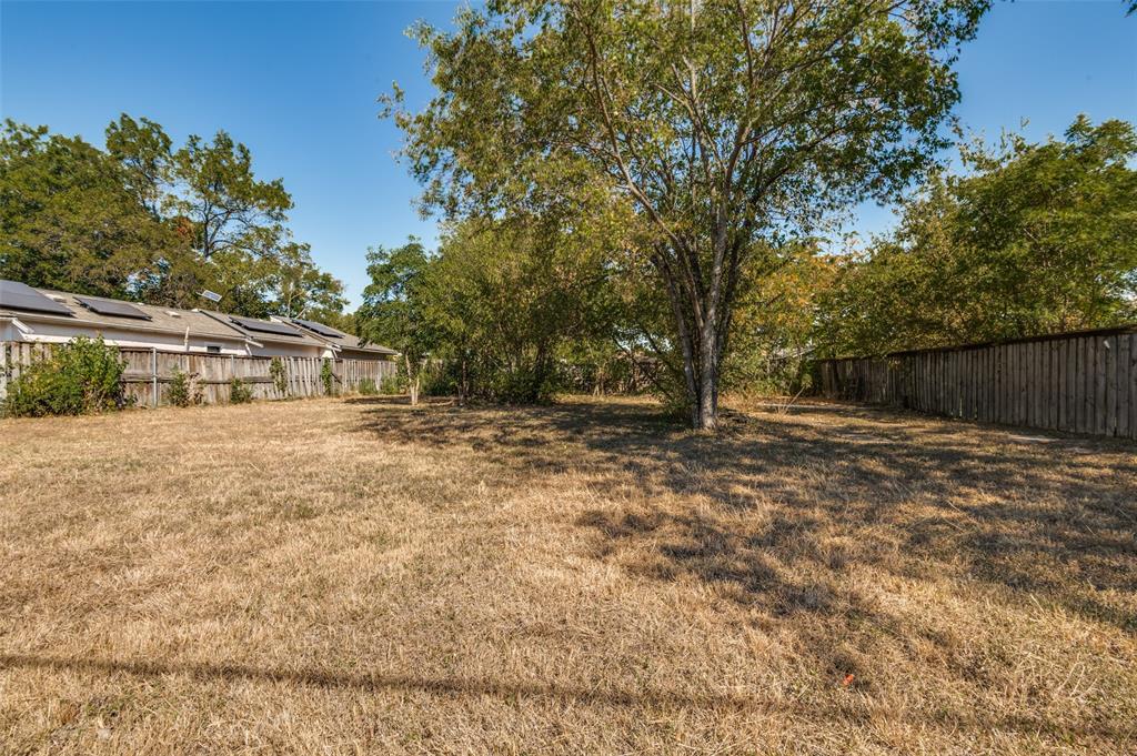 5115 Spruce Street Dallas, TX 75211 - Photo 7 of 10 a backyard of a house with lots of green space