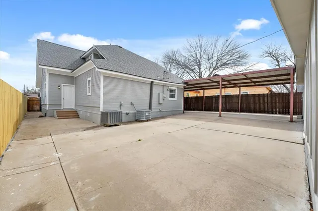 a view of a house with a snow in the yard