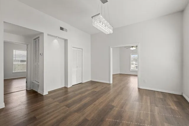 a view of livingroom with hardwood floor and kitchen view