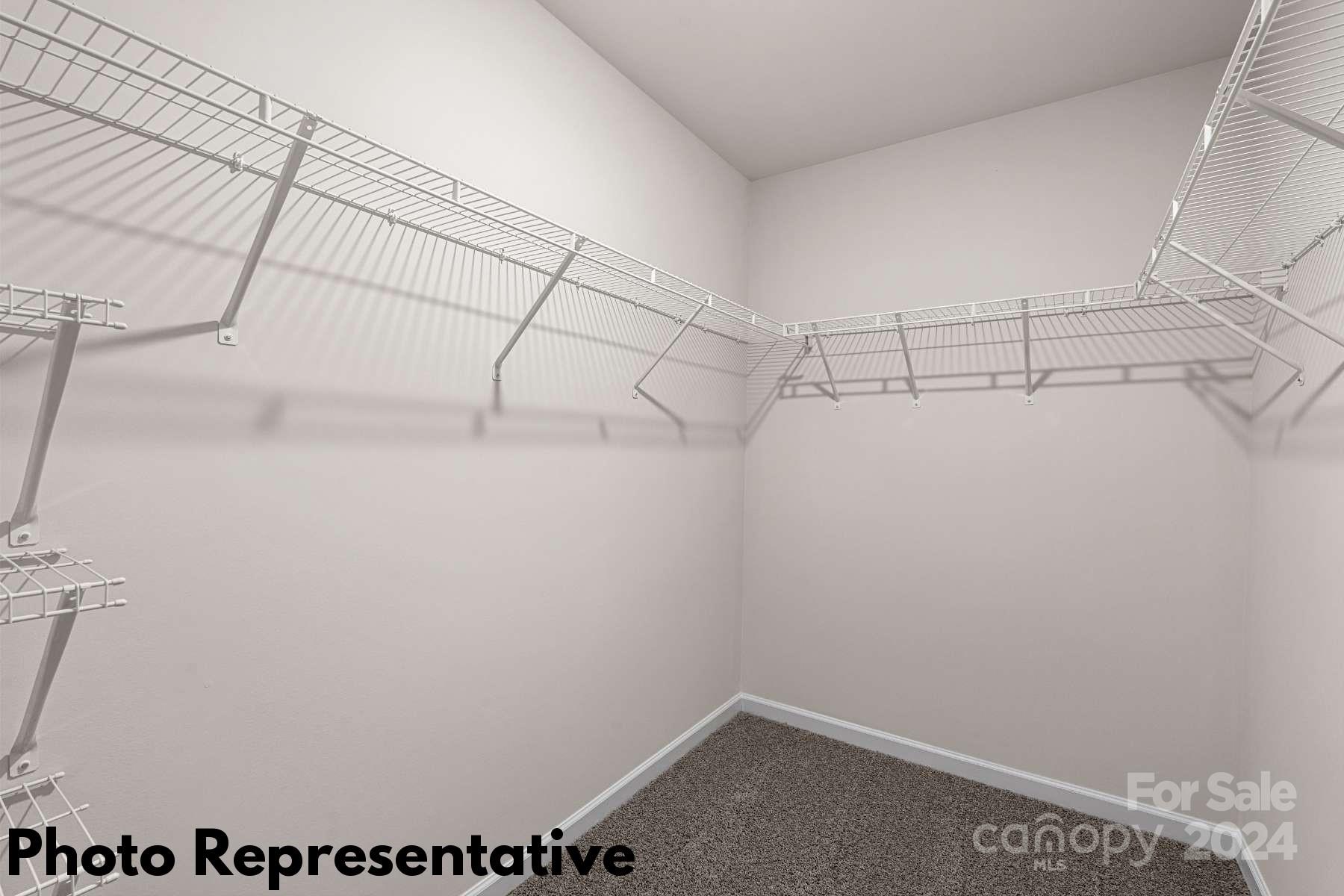 185 Wheatfield Road Fletcher, NC 28732 - Photo 23 of 28 a view of a room with racks on the wall