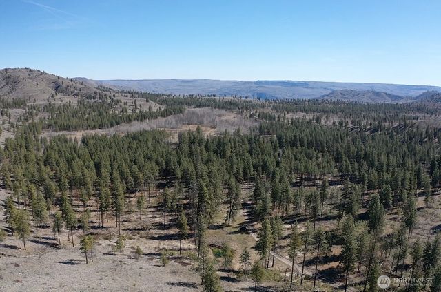 a view of a town with mountains in the background