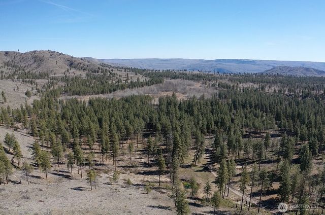 a view of a town with mountains in the background