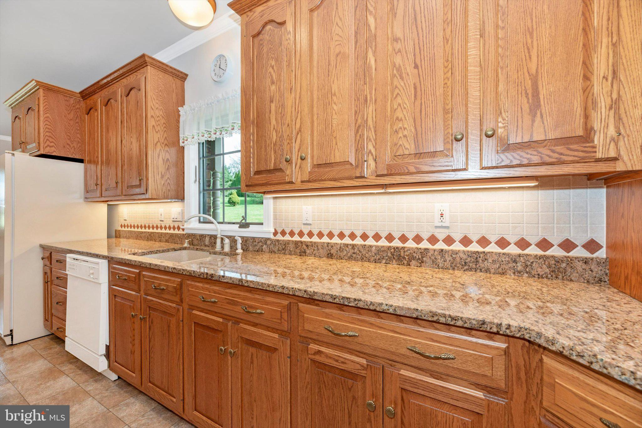 20405 Gap Court Rohrersville, MD 21779 - Photo 18 of 51 Warm oak cabinetry meets modern charm.