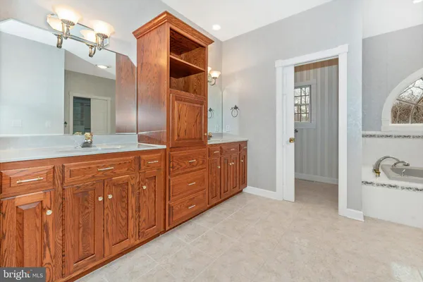 view of a bathroom with a sink and a mirror