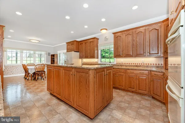 a kitchen with counter top space and appliances