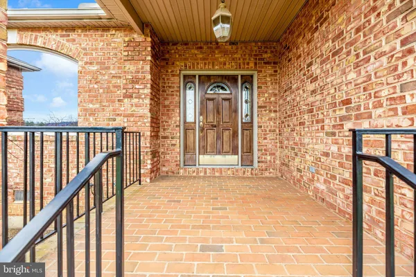 a view of a brick house with a large window