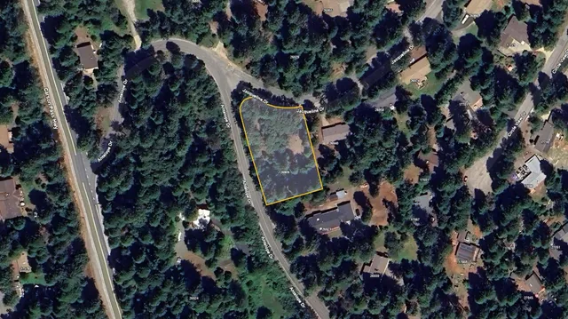 an aerial view of a residential houses with outdoor space