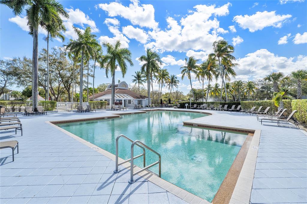 931 Lyons Road, Unit 4204 Coconut Creek, FL 33063 - Photo 11 of 13 a view of swimming pool with a patio