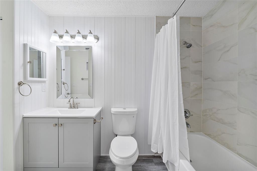 931 Lyons Road, Unit 4204 Coconut Creek, FL 33063 - Photo 5 of 13 a bathroom with a sink toilet and shower