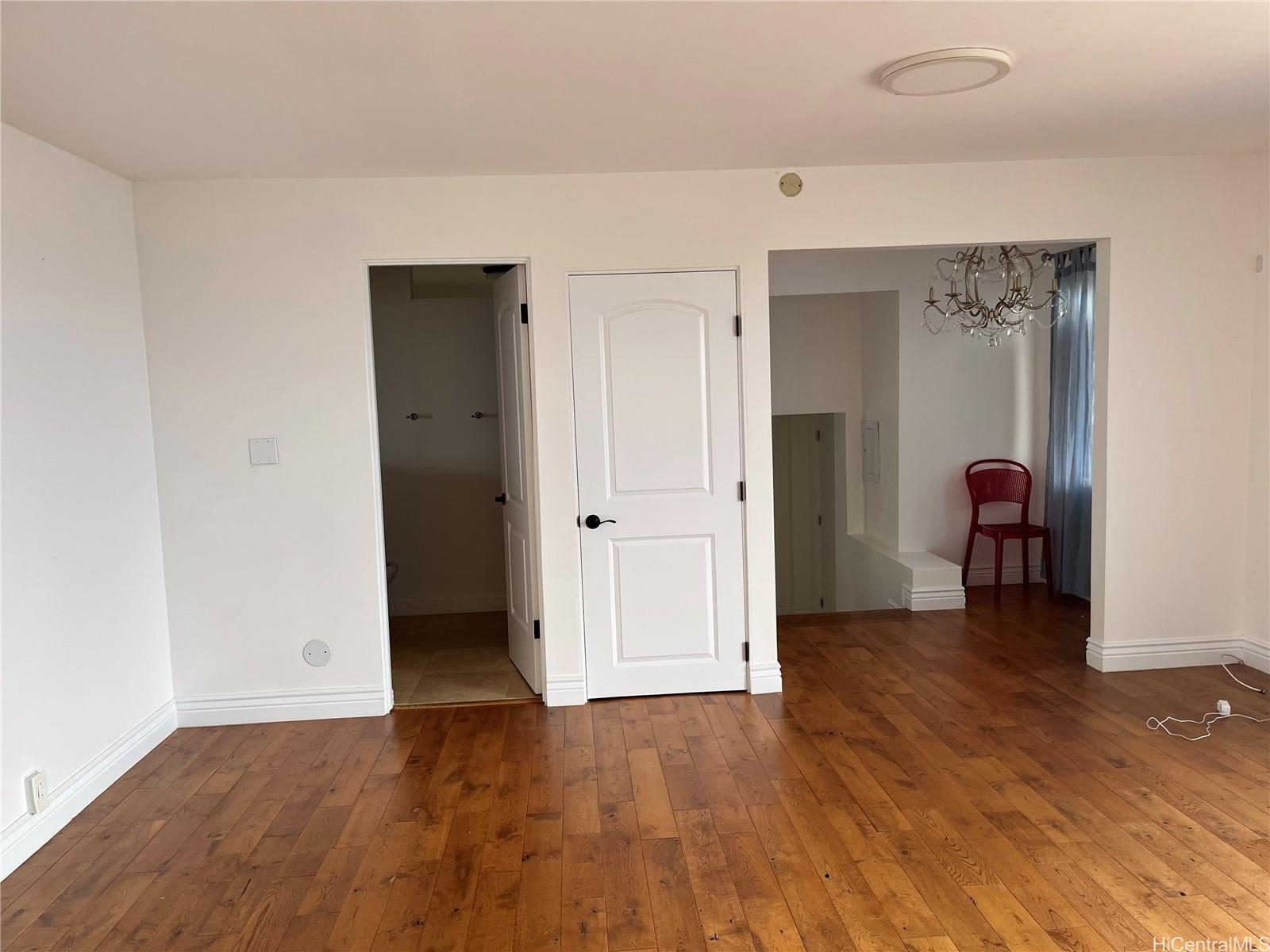 2067 Omea Place Honolulu, HI 96821 - Photo 4 of 9 a view of a livingroom with wooden floor and closet