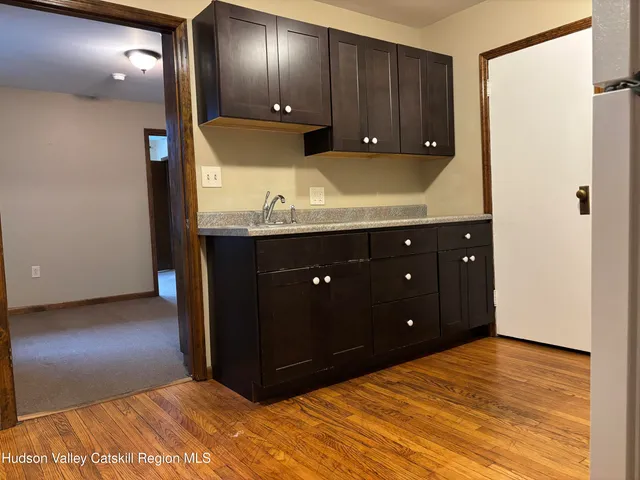 a room with a dresser and a mirror