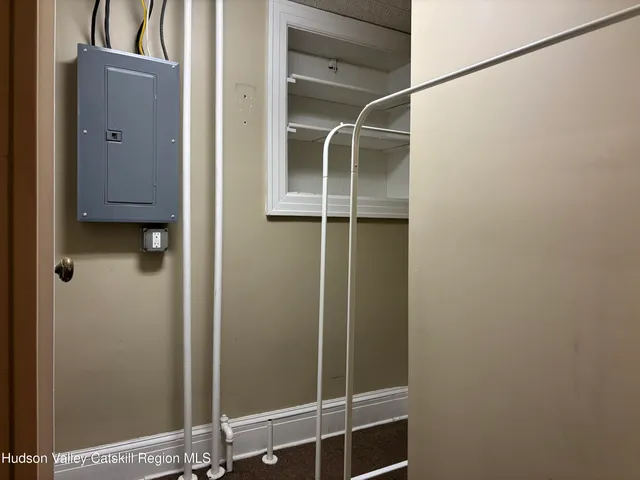 a bathroom with a glass shower door