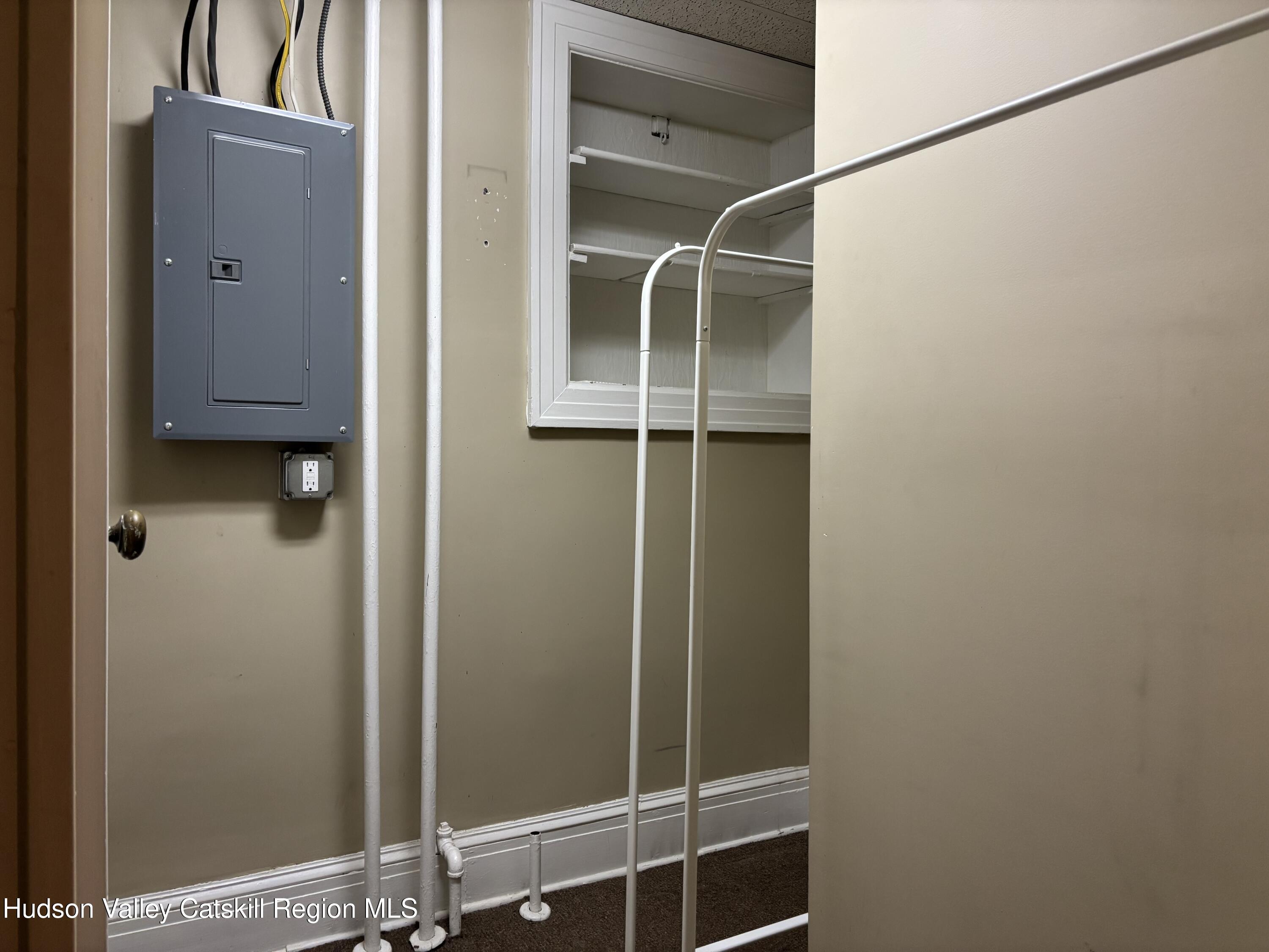 261 Fair Street, Unit B Kingston, NY 12401 - Photo 14 of 18 a bathroom with a glass shower door