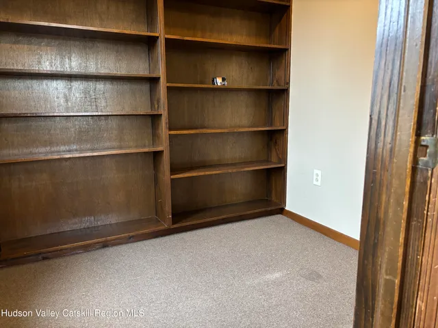 a view of an empty room with empty racks