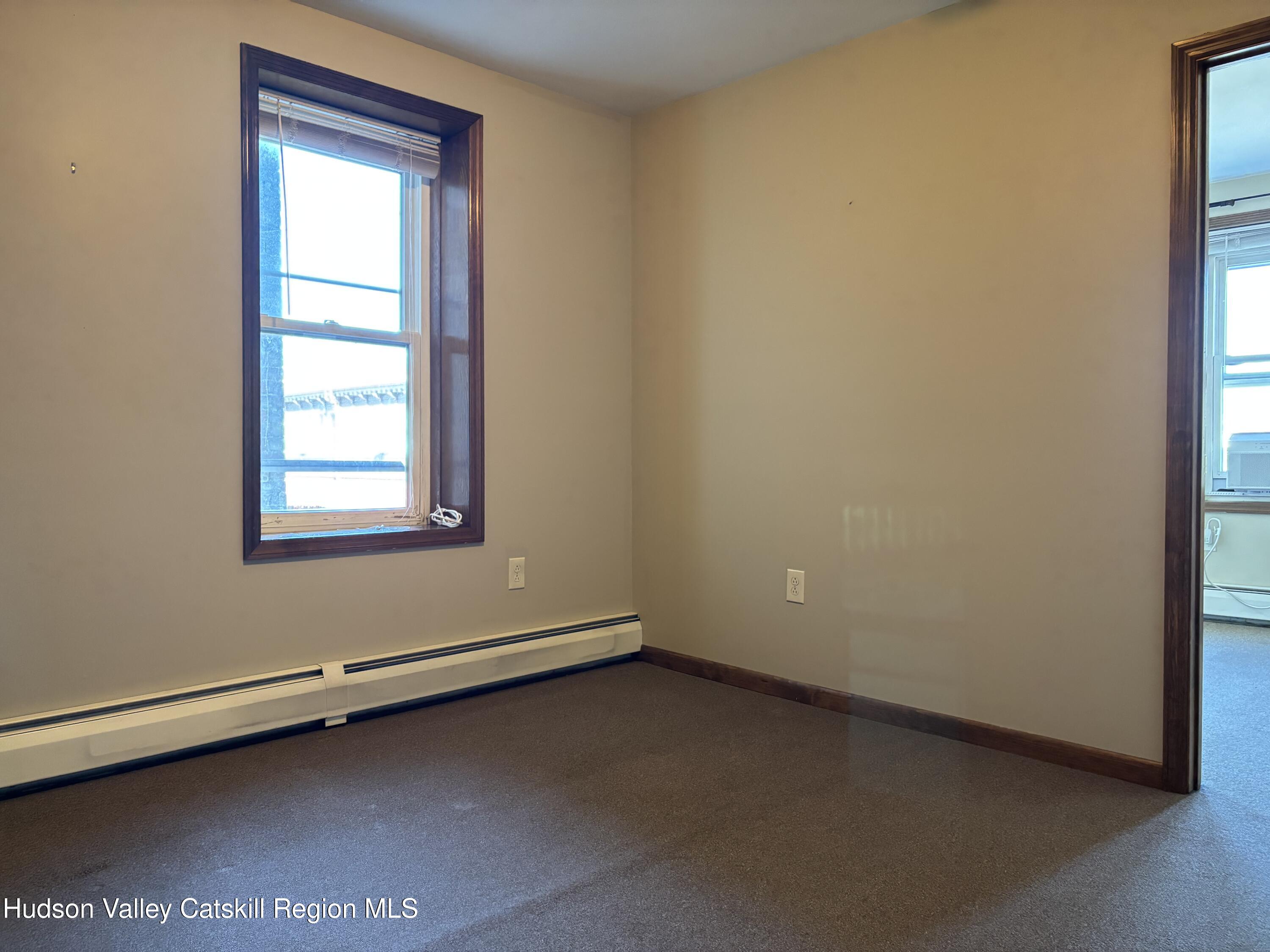 261 Fair Street, Unit B Kingston, NY 12401 - Photo 7 of 18 an empty room with a window