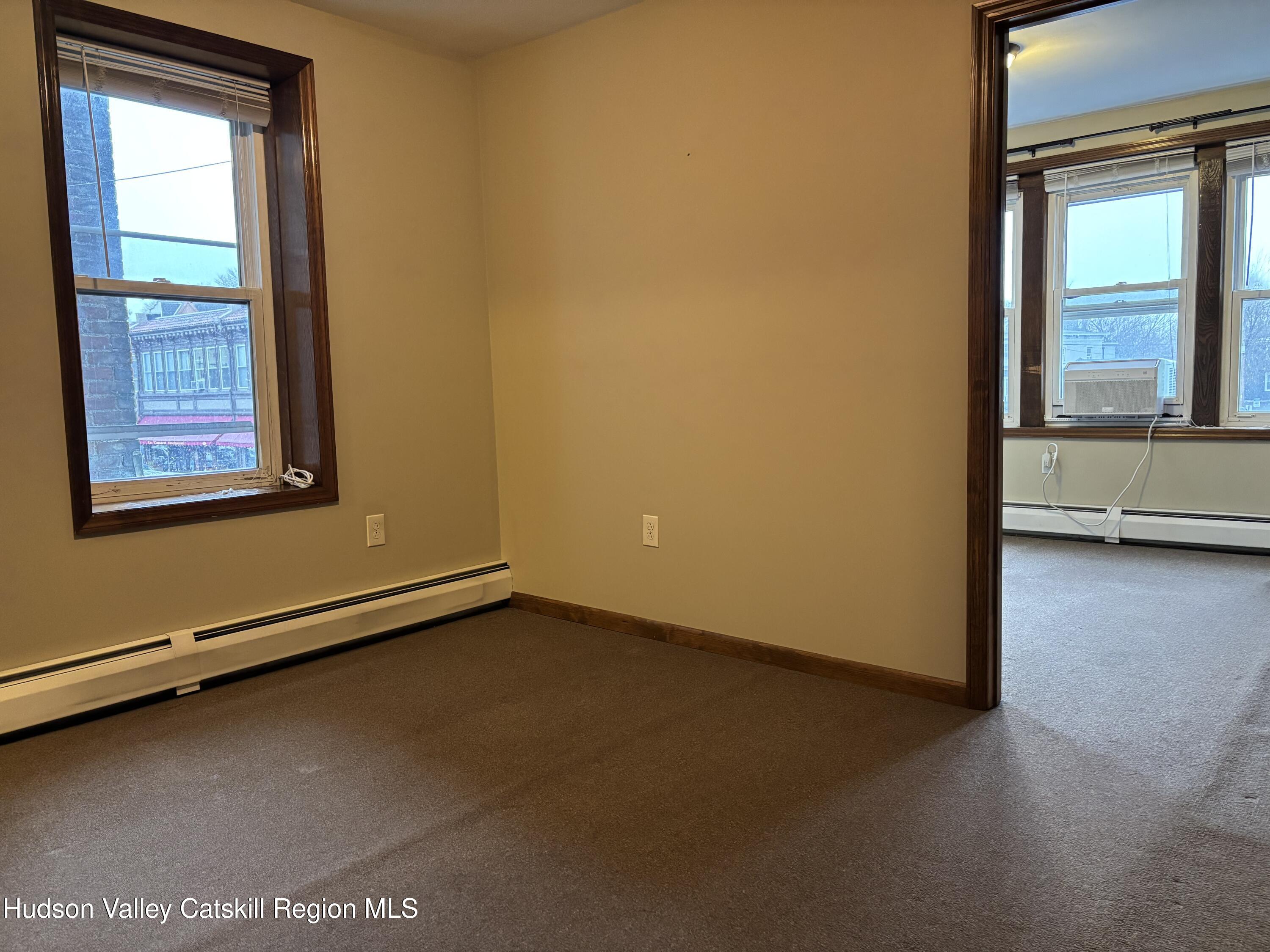 261 Fair Street, Unit B Kingston, NY 12401 - Photo 8 of 18 a view of an empty room and window