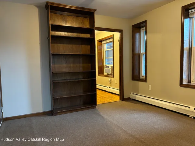 a view of an empty room with a closet
