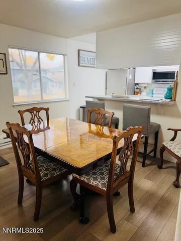a view of a dining room with furniture and window