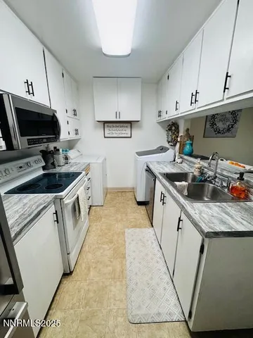a kitchen that has a sink and a stove
