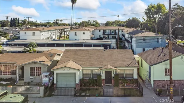 an aerial view of a house with a yard