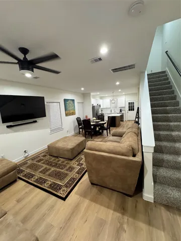 a living room with furniture and a rug