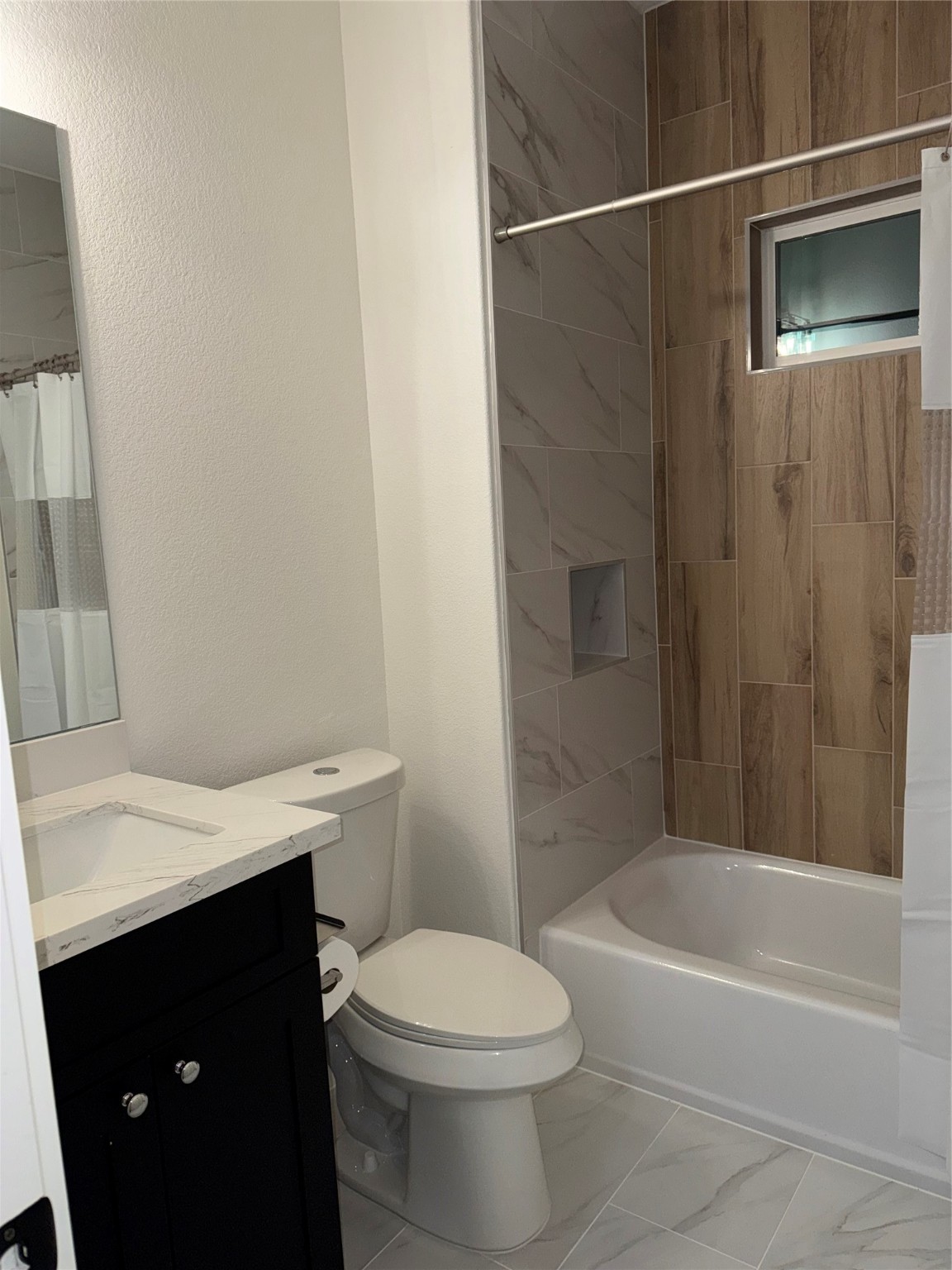 8113 Miley Street Houston, TX 77028 - Photo 8 of 8 a bathroom with a sink a toilet and shower