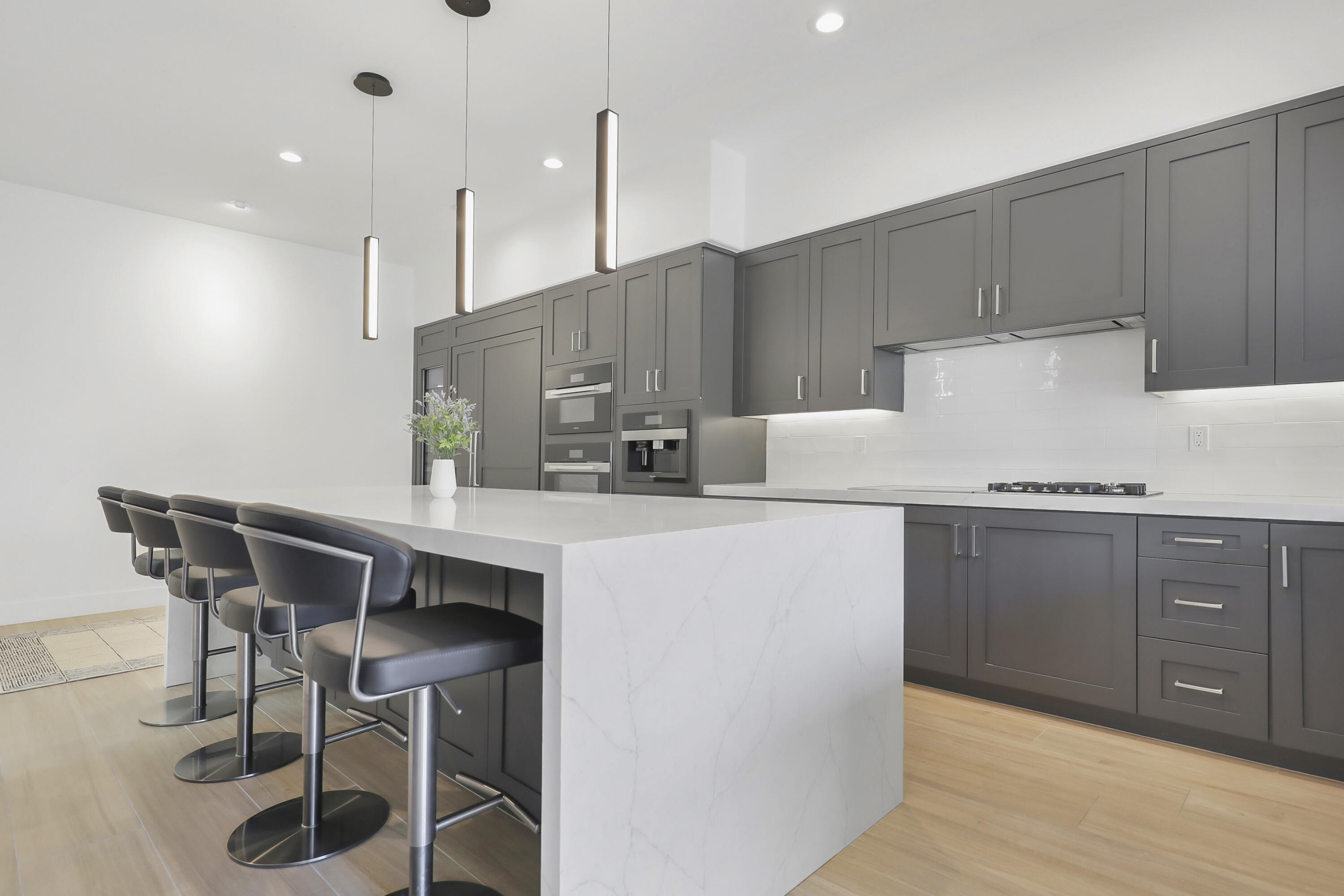 79754 Arnold Palmer La Quinta, CA 92253 - Photo 13 of 38 a kitchen with a table chairs stove and wooden cabinets