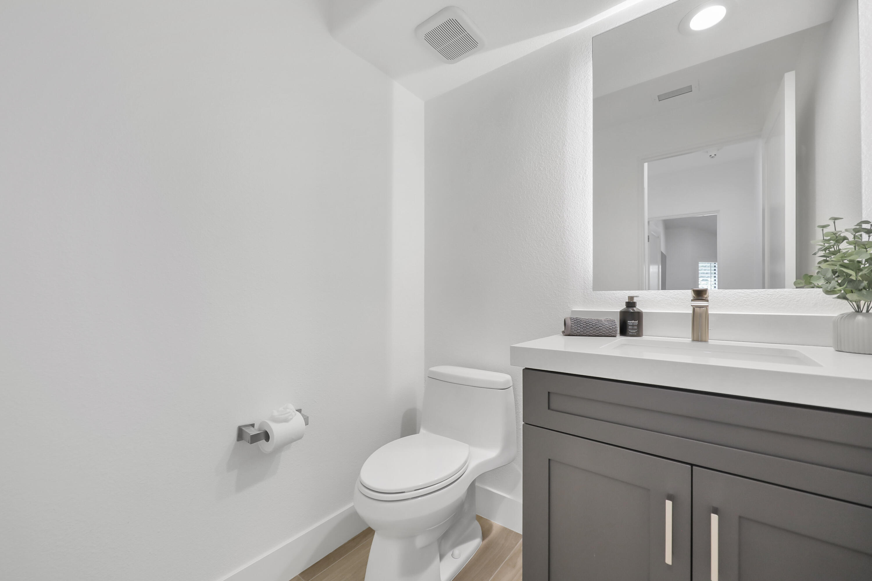 79754 Arnold Palmer La Quinta, CA 92253 - Photo 18 of 38 a bathroom with a sink a toilet and mirror