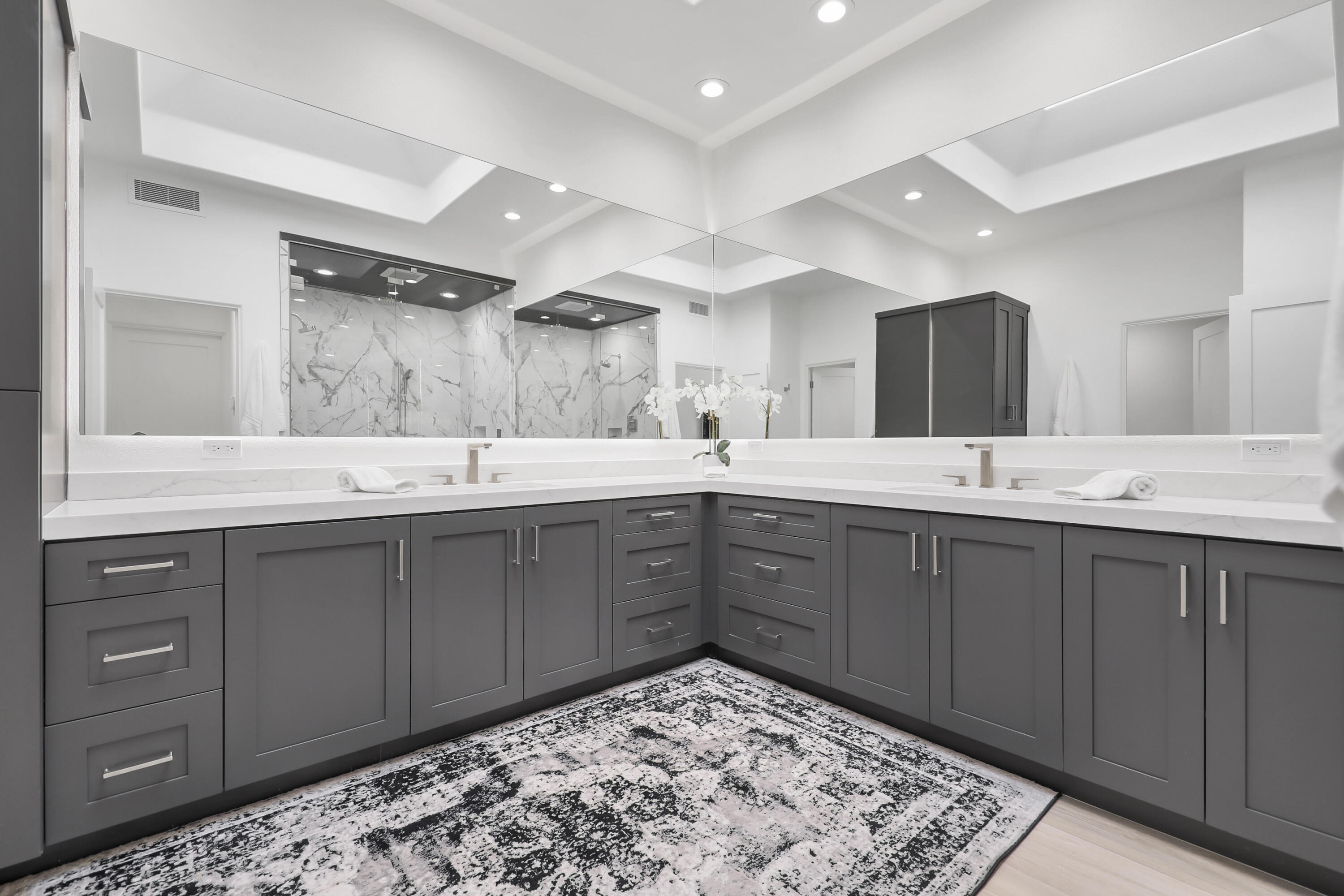 79754 Arnold Palmer La Quinta, CA 92253 - Photo 27 of 38 a spacious bathroom with a sink and a mirror