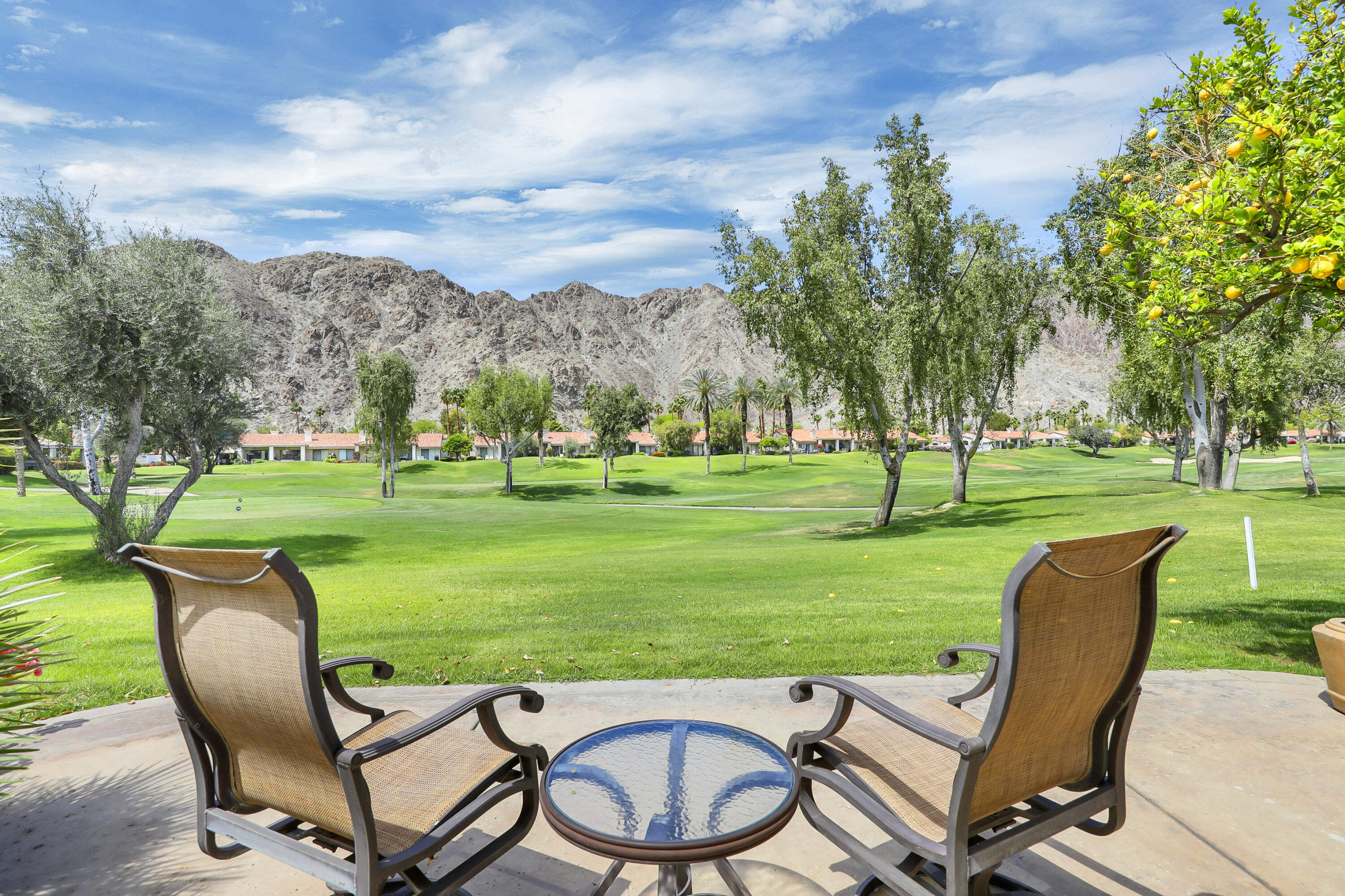 79754 Arnold Palmer La Quinta, CA 92253 - Photo 31 of 38 a view of a table and chairs in backyard