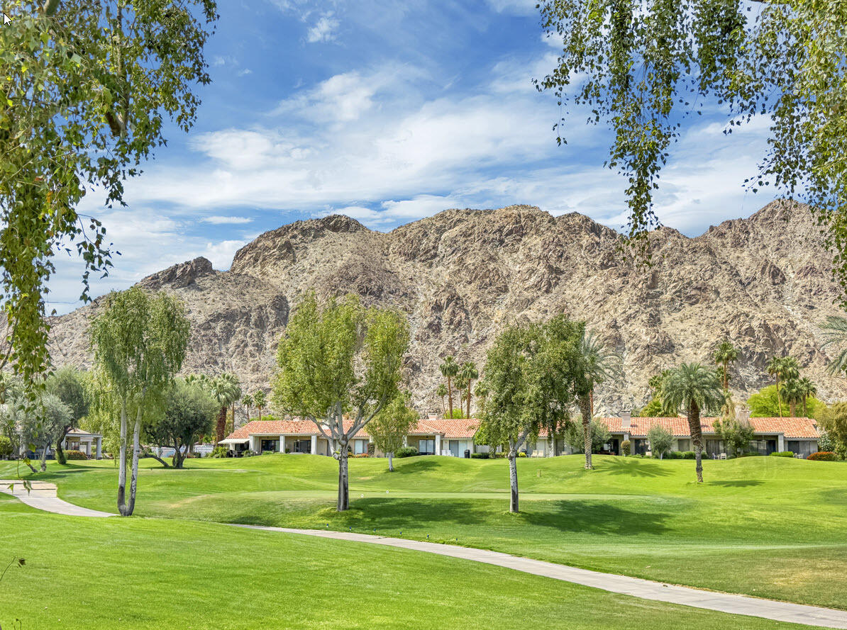 79754 Arnold Palmer La Quinta, CA 92253 - Photo 37 of 38 a view of a city with tall trees