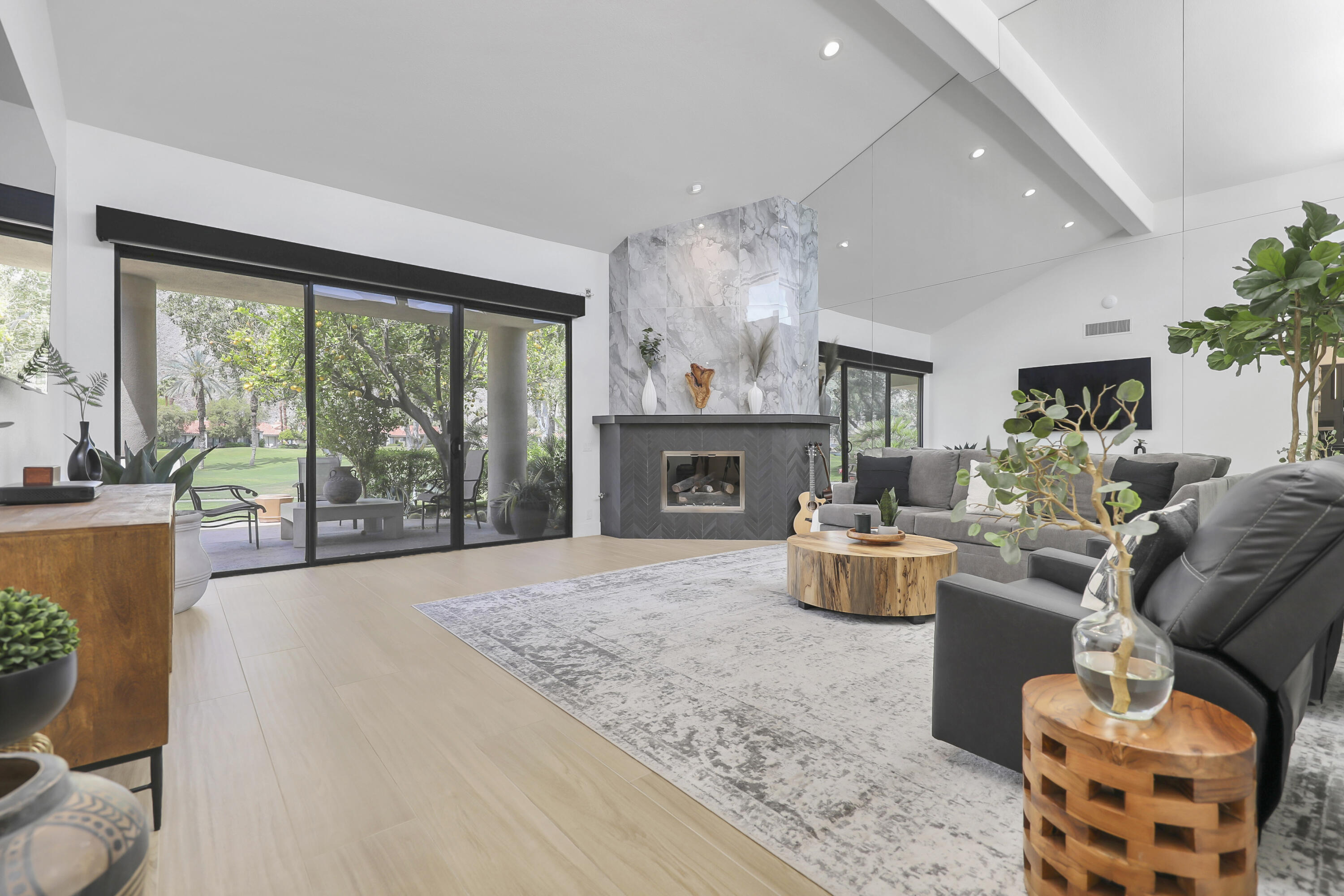 79754 Arnold Palmer La Quinta, CA 92253 - Photo 6 of 38 a living room with furniture and a fireplace