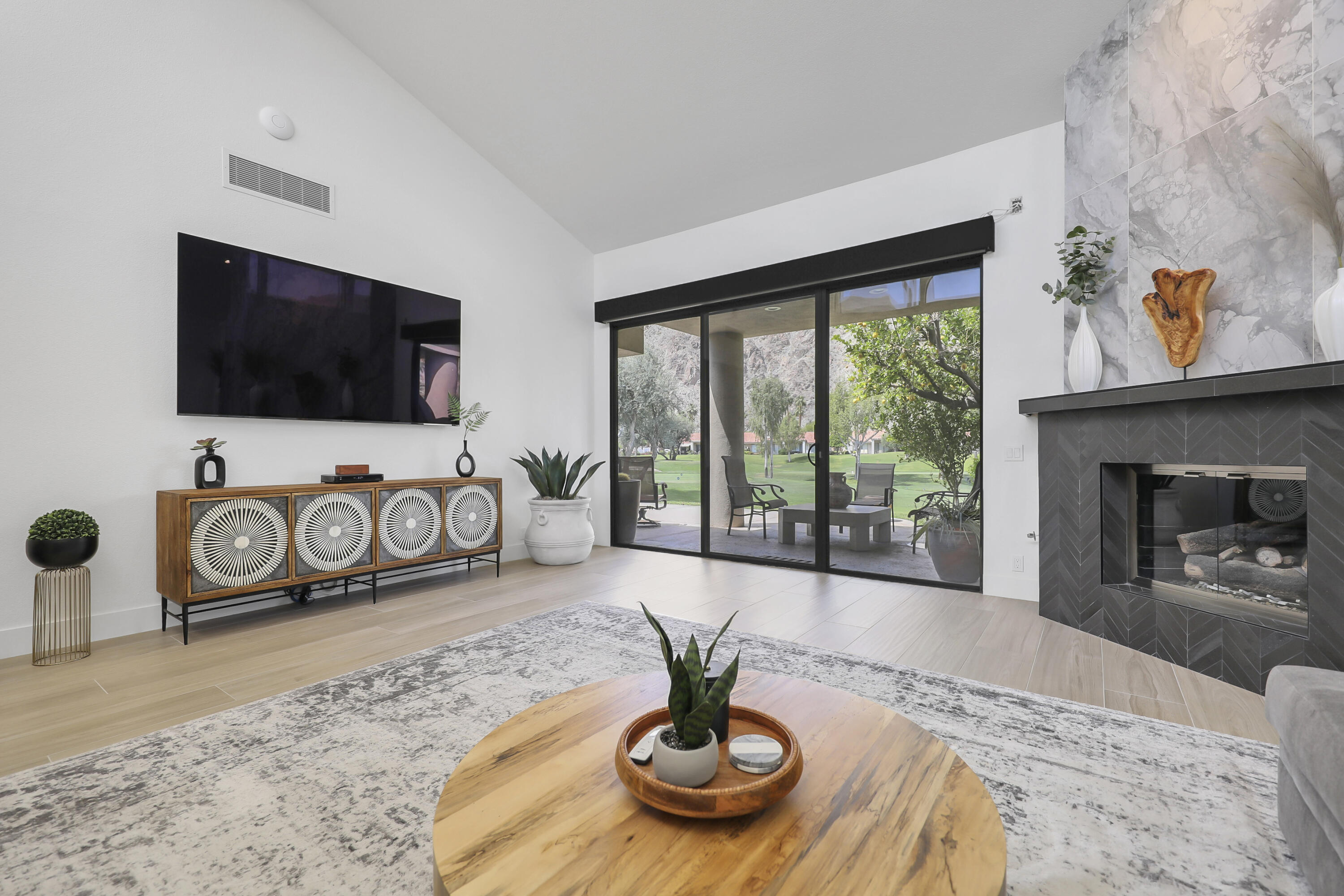 79754 Arnold Palmer La Quinta, CA 92253 - Photo 8 of 38 a view of a livingroom with furniture and a flat screen tv