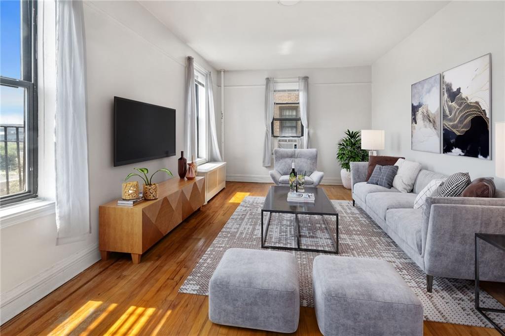 a living room with furniture and a flat screen tv