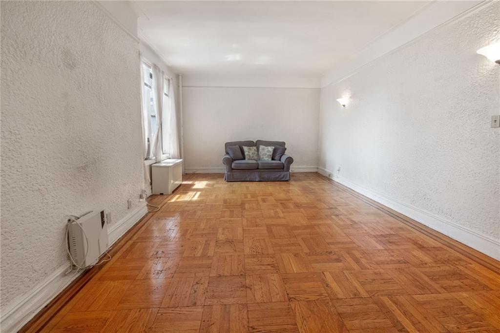 351 Marine Avenue, Unit E18 Brooklyn, NY 11209 - Photo 5 of 13 a very nice looking room with a rug