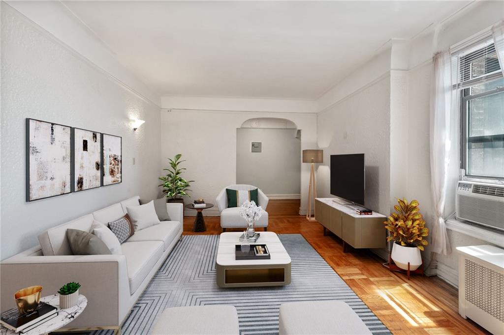 351 Marine Avenue, Unit E18 Brooklyn, NY 11209 - Photo 6 of 13 a living room with furniture and a flat screen tv