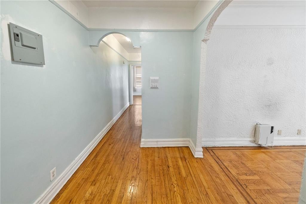 351 Marine Avenue, Unit E18 Brooklyn, NY 11209 - Photo 9 of 13 a bathroom with a sink and a mirror