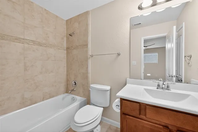 a bathroom with a sink toilet a bathtub and shower