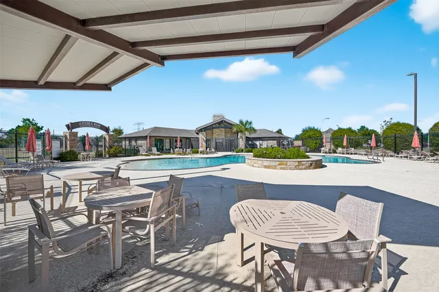 a dining table and chairs with the table and chairs