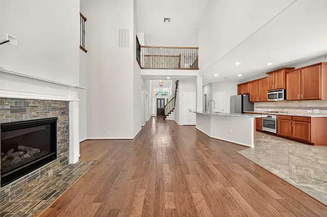 a view of kitchen with cabinets and wooden floor