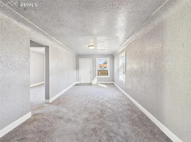 a view of empty room with windows