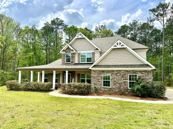 front view of a house with a yard