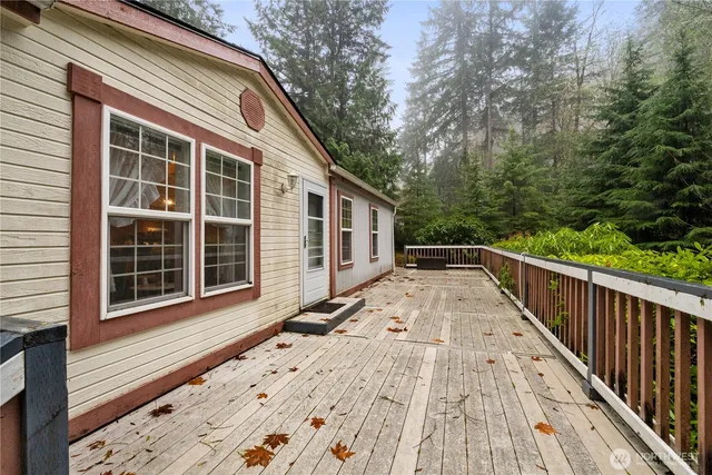 a view of house with backyard and wooden floor