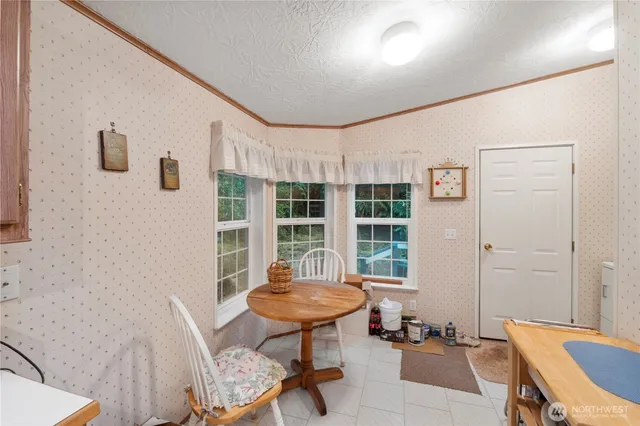 a view of a room with furniture and windows